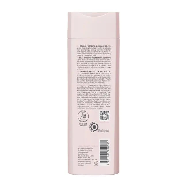 Back of a pink shampoo bottle with text and logos on a white background
