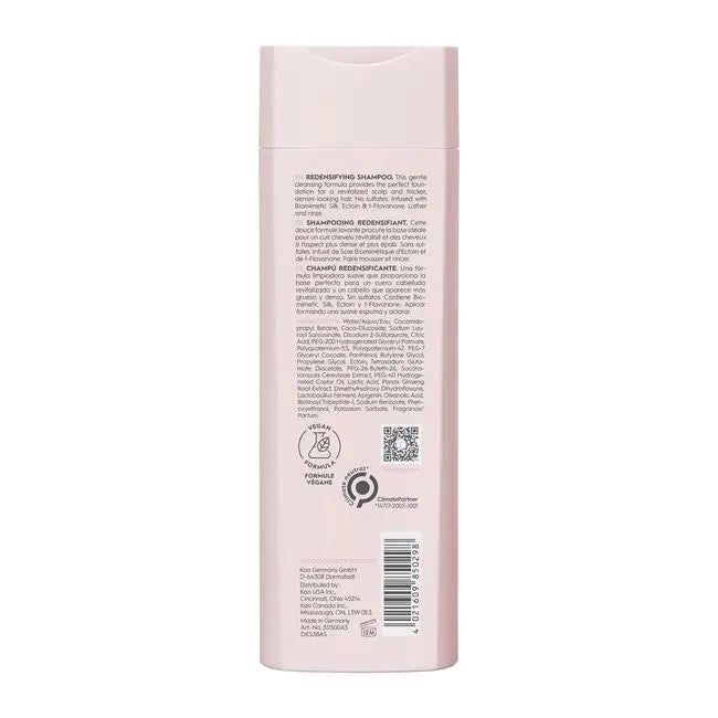 Back of a pink shampoo bottle with text and logos on a white background