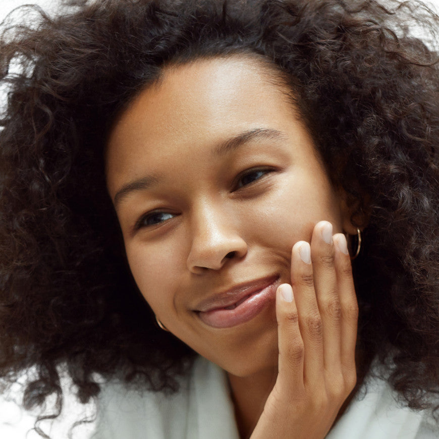 Lady Touching her Face