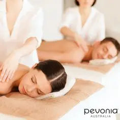 Two people receiving massages with a Pevonia Australia logo in the background