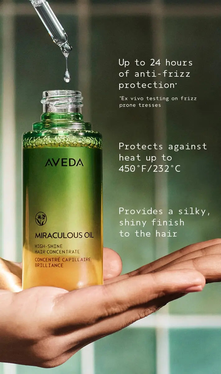 Aveda miraculous oil bottle with dropper and text about product benefits