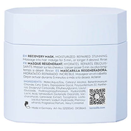 Back of a blue hair mask packaging with text and a QR code.