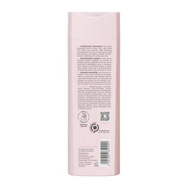 Back view of a pink shampoo bottle with text and logos on a white background