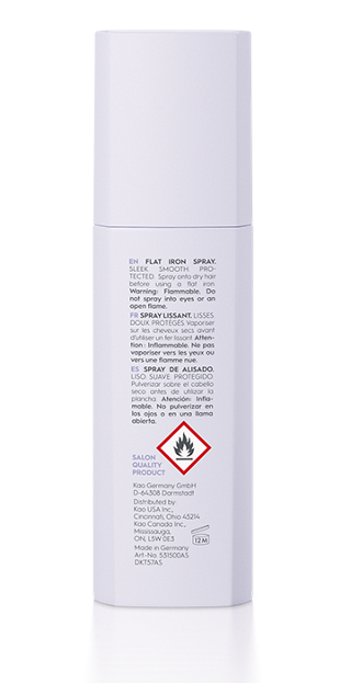 White spray bottle with text and a red warning label on a white background