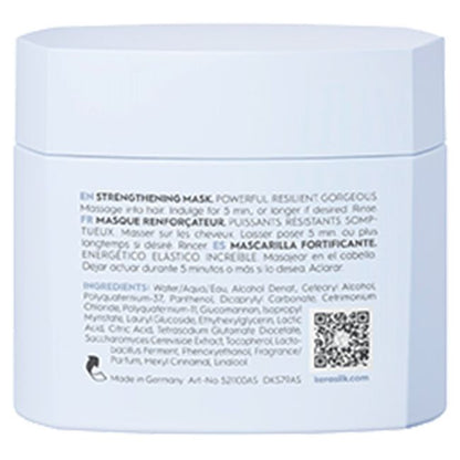 Back of a blue hair mask packaging with text and a QR code.