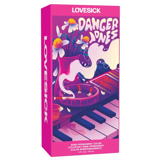 Pink packaging of Lovesick Danger Dyes with a piano and flowers design on a white background