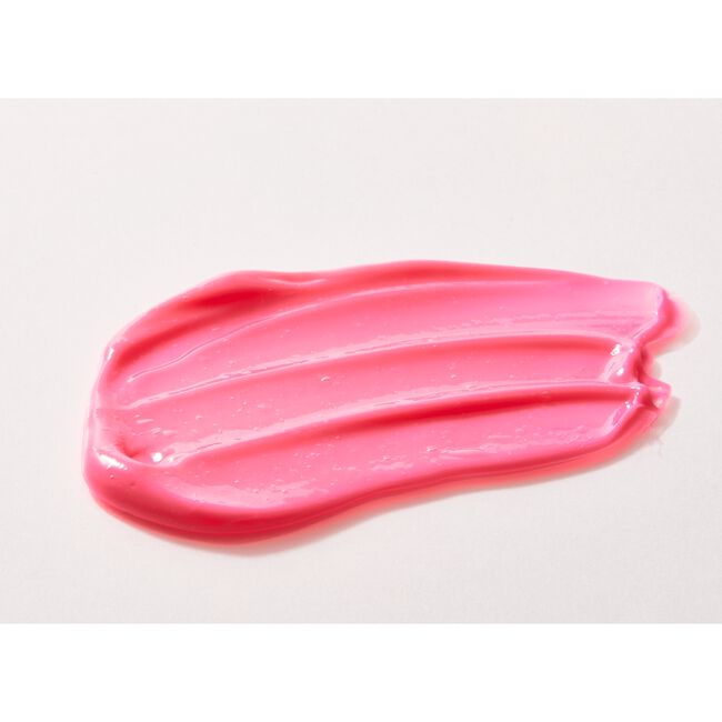 Pink lip balm smear on a white background
