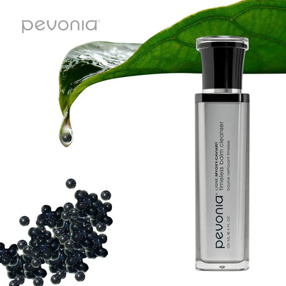 Pevonia bottle with black beads and a green leaf on a white background