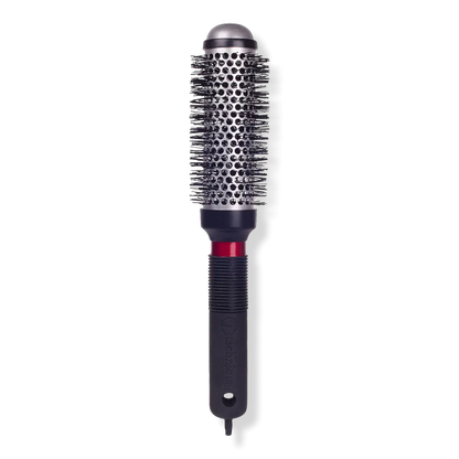 Hair styling brush with black bristle head and black handle on a white background