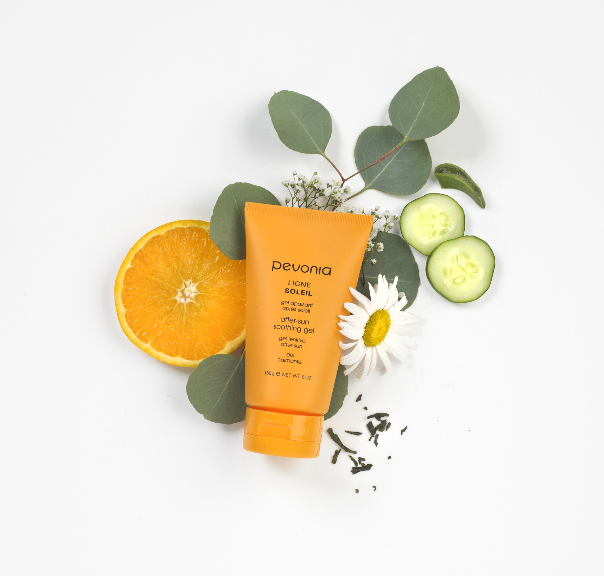 Pevonia sunscreen bottle with orange, cucumber, and flowers on a white background