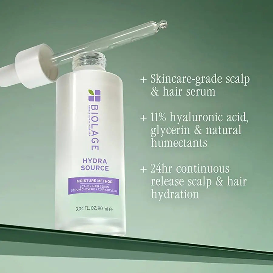 Biolage Hydra Source skincare-grade scalp and hair serum bottle with dropper on a green background