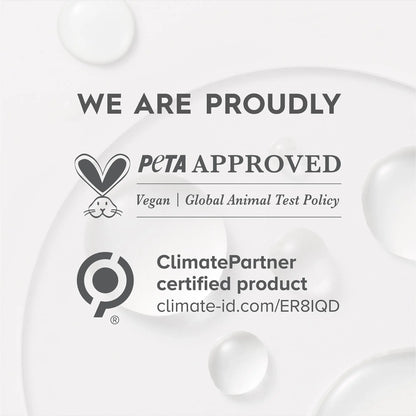 PETA Approved and ClimatePartner certified product labels on a white background with water droplets.