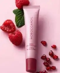 Lip Balm with raspberry fruit on pink background