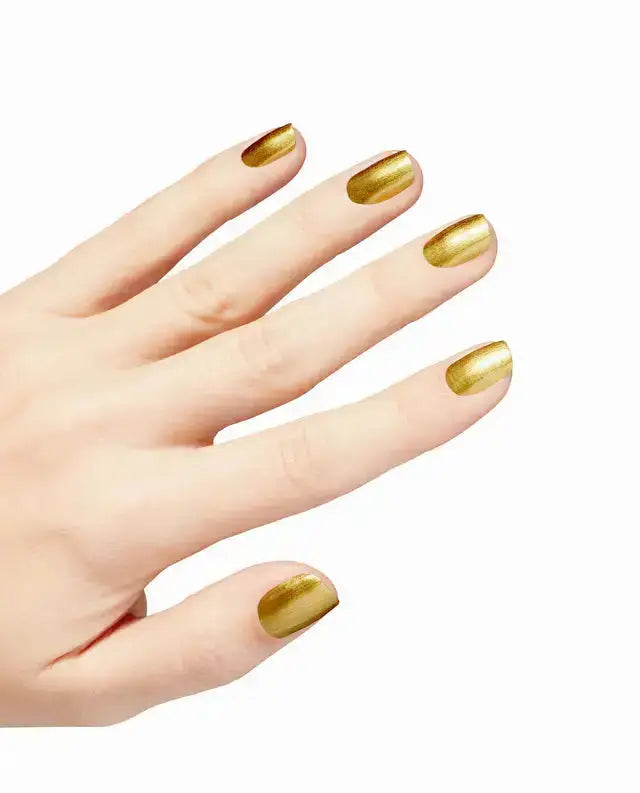 Hand with gold nail polish on a white background